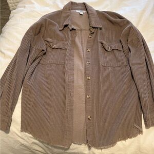 Medium brown button down shirt.